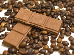 two chocolate bars with coffee beans HD wallpaper