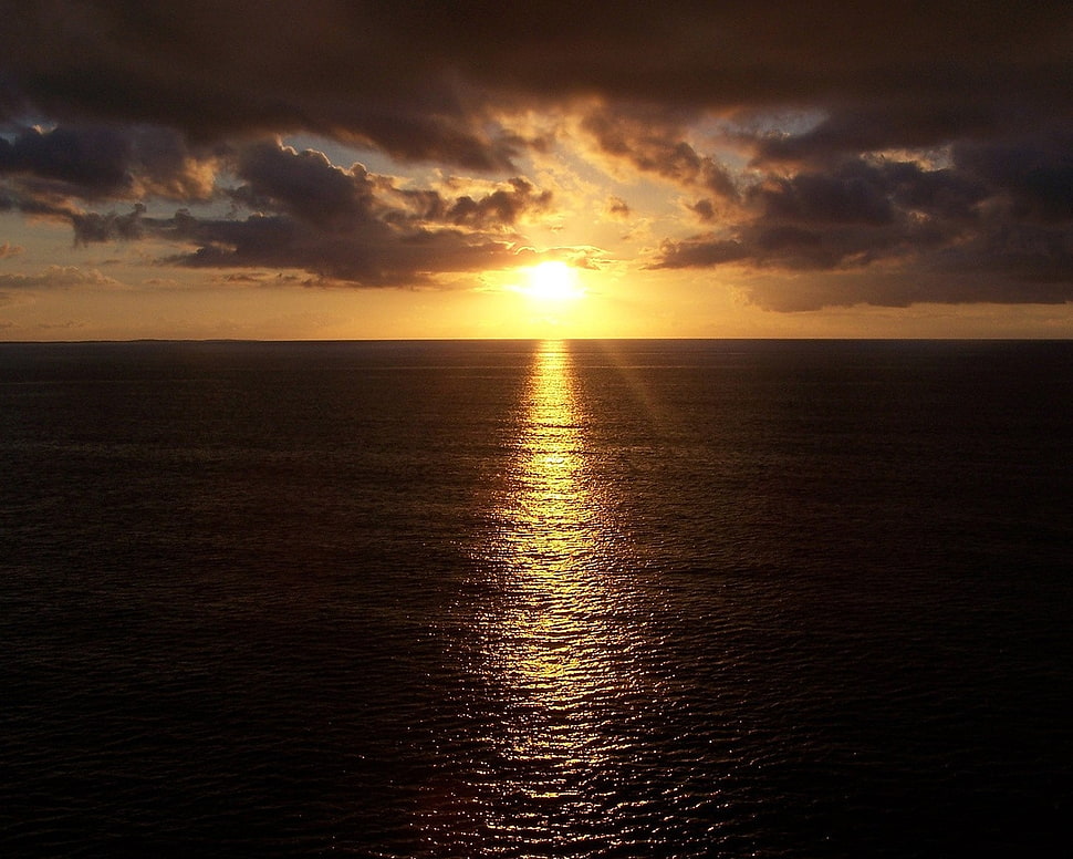 sunlight over nimbus clouds HD wallpaper