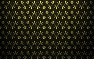 black and beige skull and sword print textile