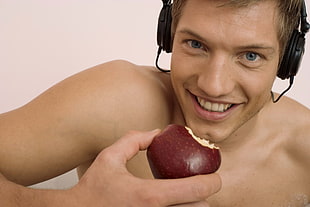 man eating apple HD wallpaper