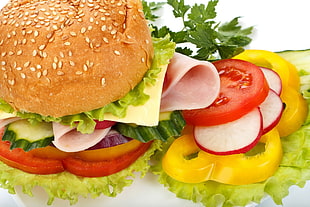 burger with tomato, pineapple, and lettuce