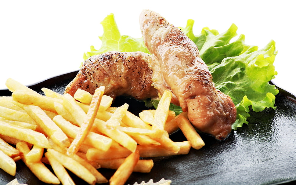 french fries and fried meat with vegetable served on black tray HD wallpaper