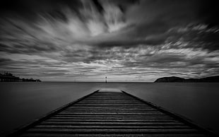 grayscale photo of wooden dock, llandudno