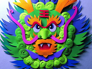 green, blue, orange and purple Chinese dragon paper art