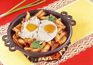 fried potatoes with fried egg on top
