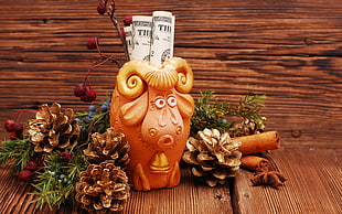 brown ram figurine, Christmas, New Year, wooden surface, cones HD wallpaper