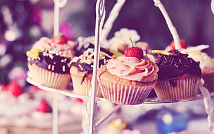 cupcake with toppings on basket