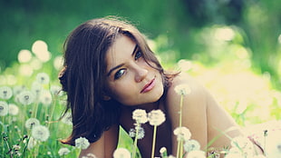 woman prone on flower field photo