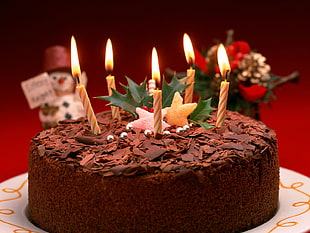 black forest chocolate cake with five candles