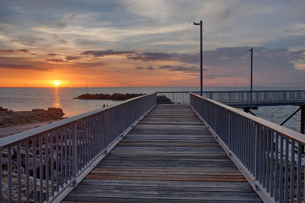 gray dock under cloudy sky during sunset HD wallpaper