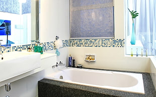 white bathtub inside white room HD wallpaper