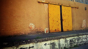 brown and black wooden cabinet, wall, yellow, door, arrows