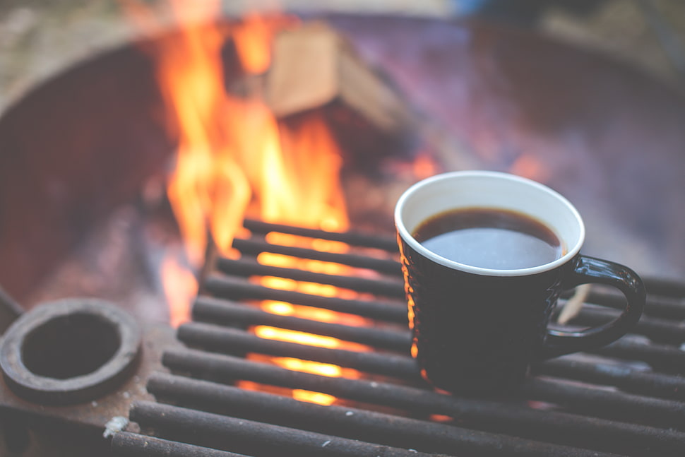 black ceramic mug on black rusty metal grille frame HD wallpaper