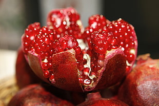 opened round red fruit close photography