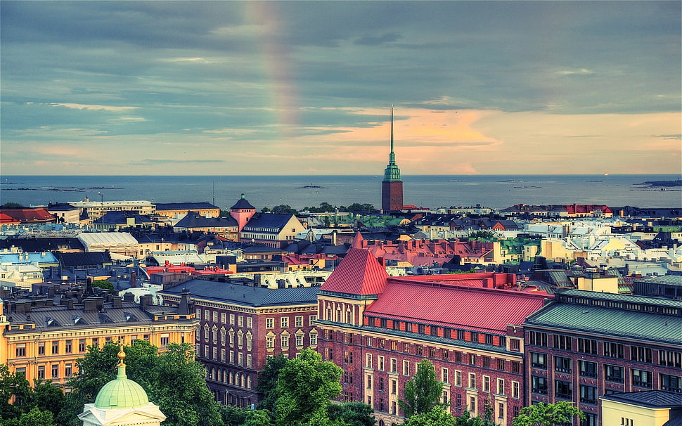 photo of town under cloudy sky HD wallpaper