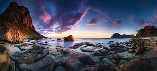 rock mountains surrounded by body of water, long exposure, sunset, beach, cliff