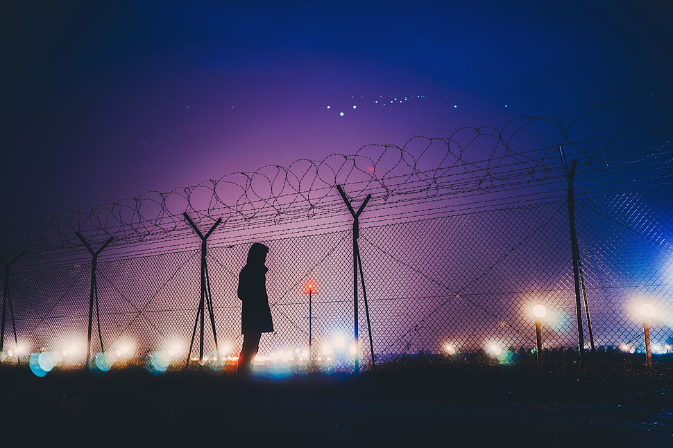 silhouette photo of person near fence HD wallpaper