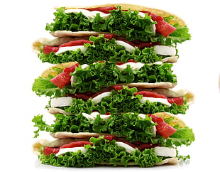 stack of lettuce, tomato slice, and red bell pepper