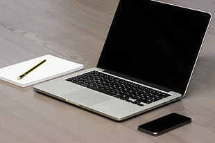 MacBook Pro beside black iPhone 5 HD wallpaper