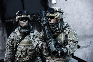 portrait of two soldiers holding RPG