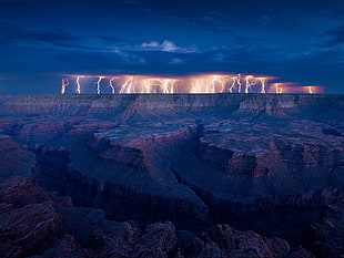 landscape photography of lightning on brown mountain