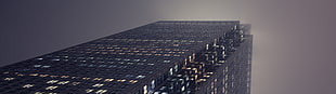 black concrete building, dual monitors, multiple display, skyscraper, lights