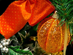 orange bauble ball on green christmas tree HD wallpaper