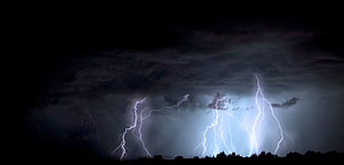 photo of lightning strikes during rainy day