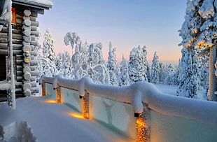 handrail covered with snow during daytime