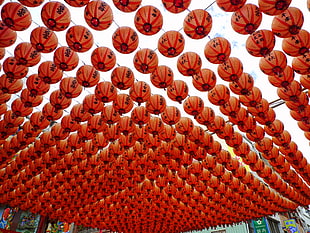 red paper lanterns under clear skies during day