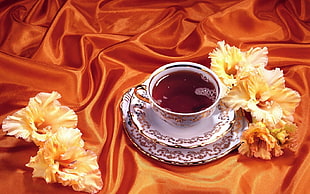 teacup filled with brown liquid HD wallpaper