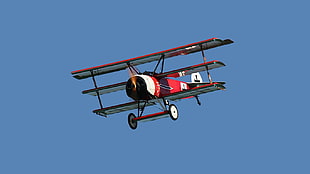 red monoplane, Triplane, aircraft, propeller, vehicle HD wallpaper
