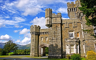 low angle photo of gray concrete castle taken during daytime