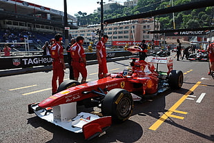 photography of men in red racing event