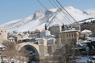 white and brown concrete buildings, Mostar, old bridge, winter, snow