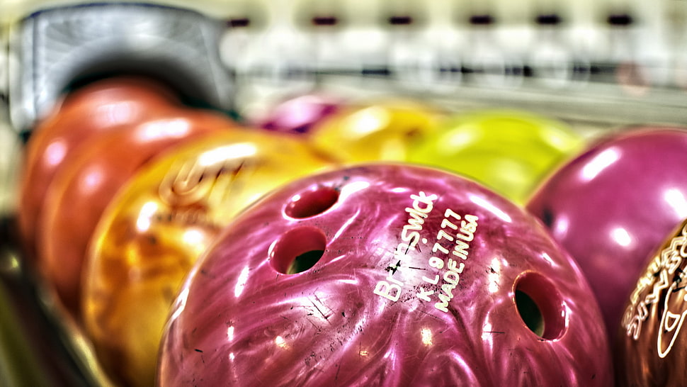 selective focus photo of bowling balls HD wallpaper