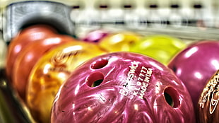 selective focus photo of bowling balls