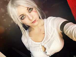 white haired woman wearing white scoop-neck dress shirt