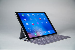 black iPad with gray keyboard