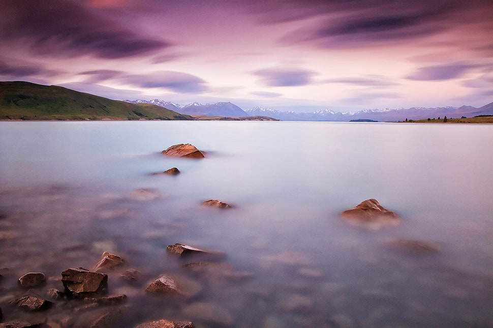 body of water under cloudy blue sky during daytime HD wallpaper