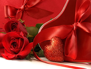 photo of red rose with ribbon