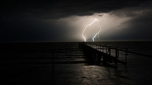 black and brown wooden dock, lightning, sea, sky, night