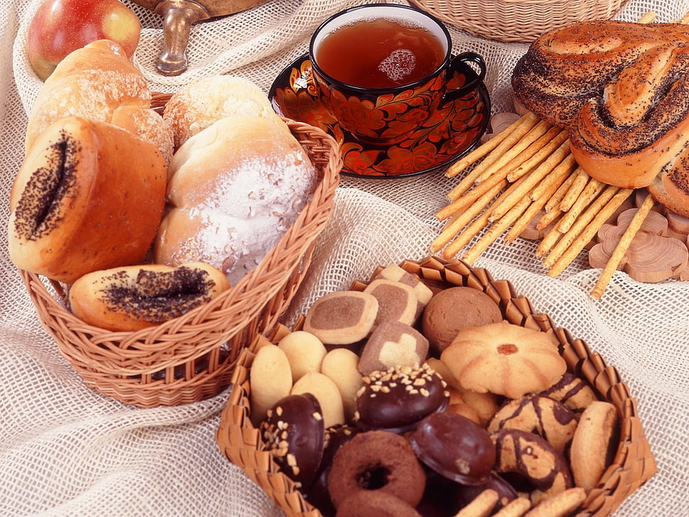 assorted breads and biscuits in brown wicker baskets HD wallpaper