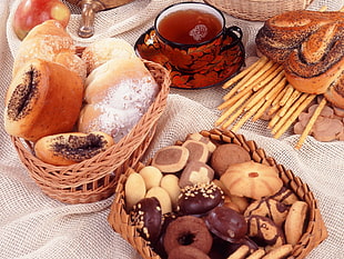 assorted breads and biscuits in brown wicker baskets