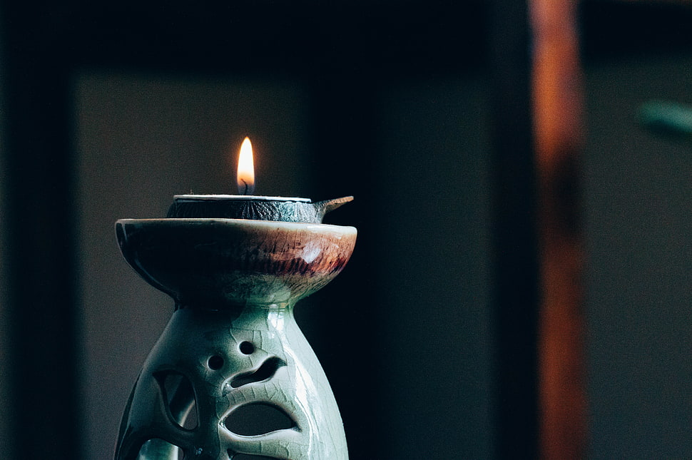 selective focus photography of green ceramic oil candle diffuser HD wallpaper