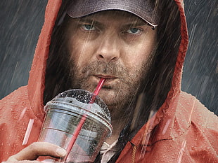 man wearing red hoodie jacket sipping on clear plastic cup under the rain HD wallpaper