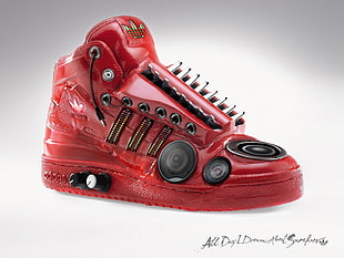 unpaired red leather Adidas high-top sneaker