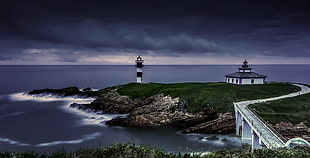 white lighthouse near body of water HD wallpaper