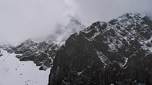 grayscale photo of rock formation, landscape, snow, mountains, mist