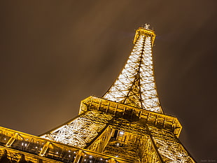Eiffel tower lit during nighttime HD wallpaper